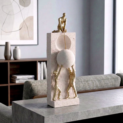 Teamwork figurine sculpture lifting sphere on textured stone base in black and white variants
