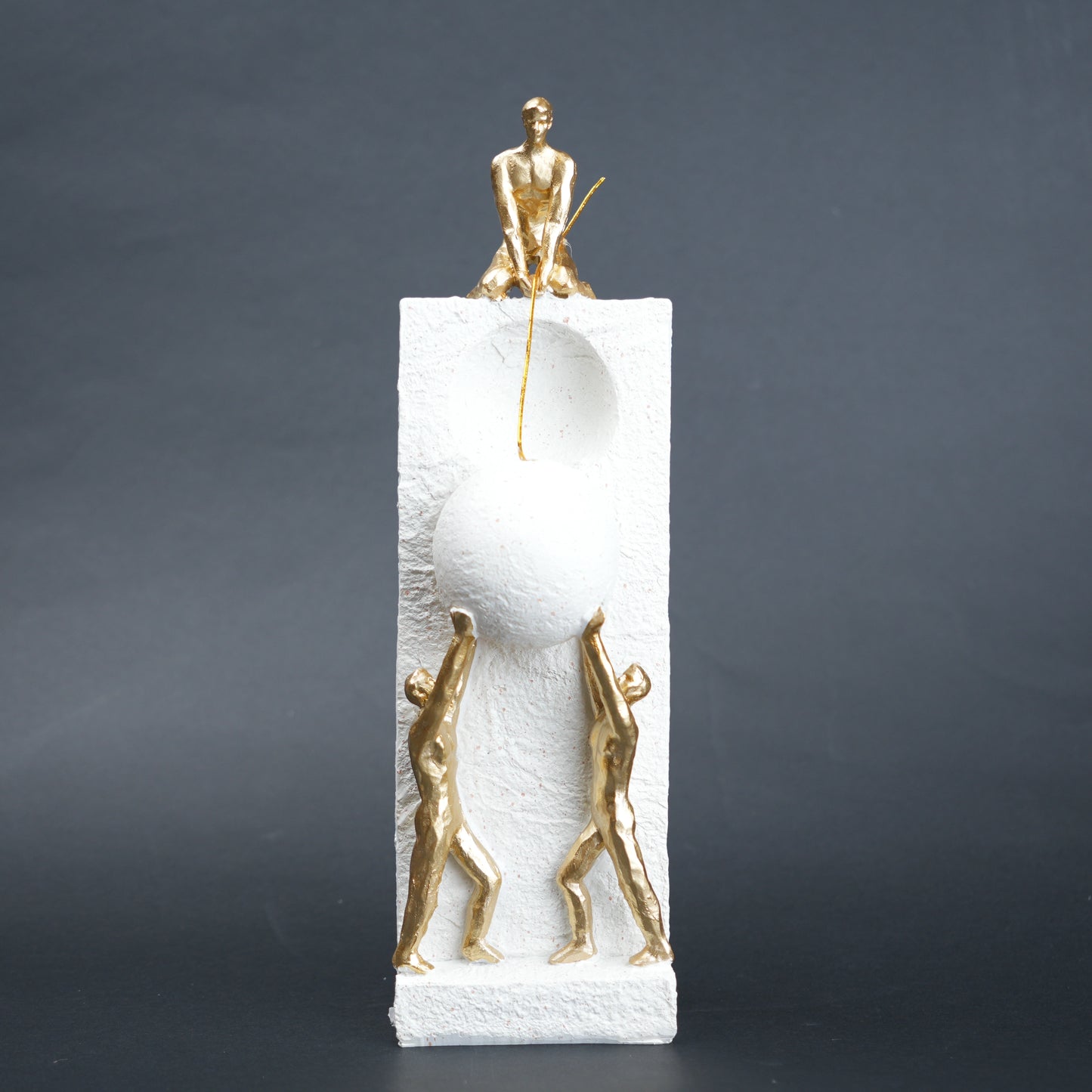 Teamwork figurine sculpture lifting sphere on textured stone base in black and white variants