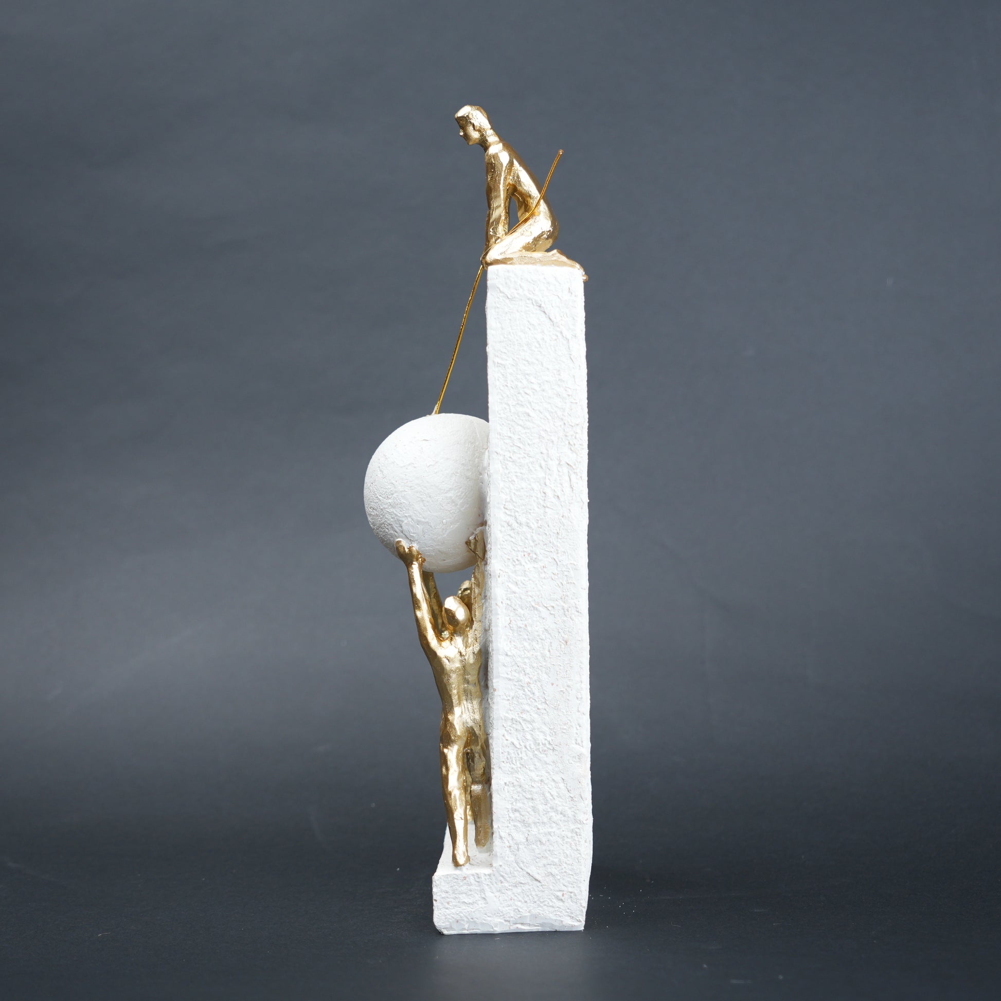 Teamwork figurine sculpture lifting sphere on textured stone base in black and white variants