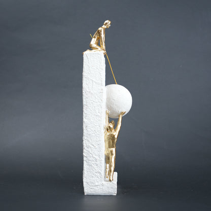 Teamwork figurine sculpture lifting sphere on textured stone base in black and white variants