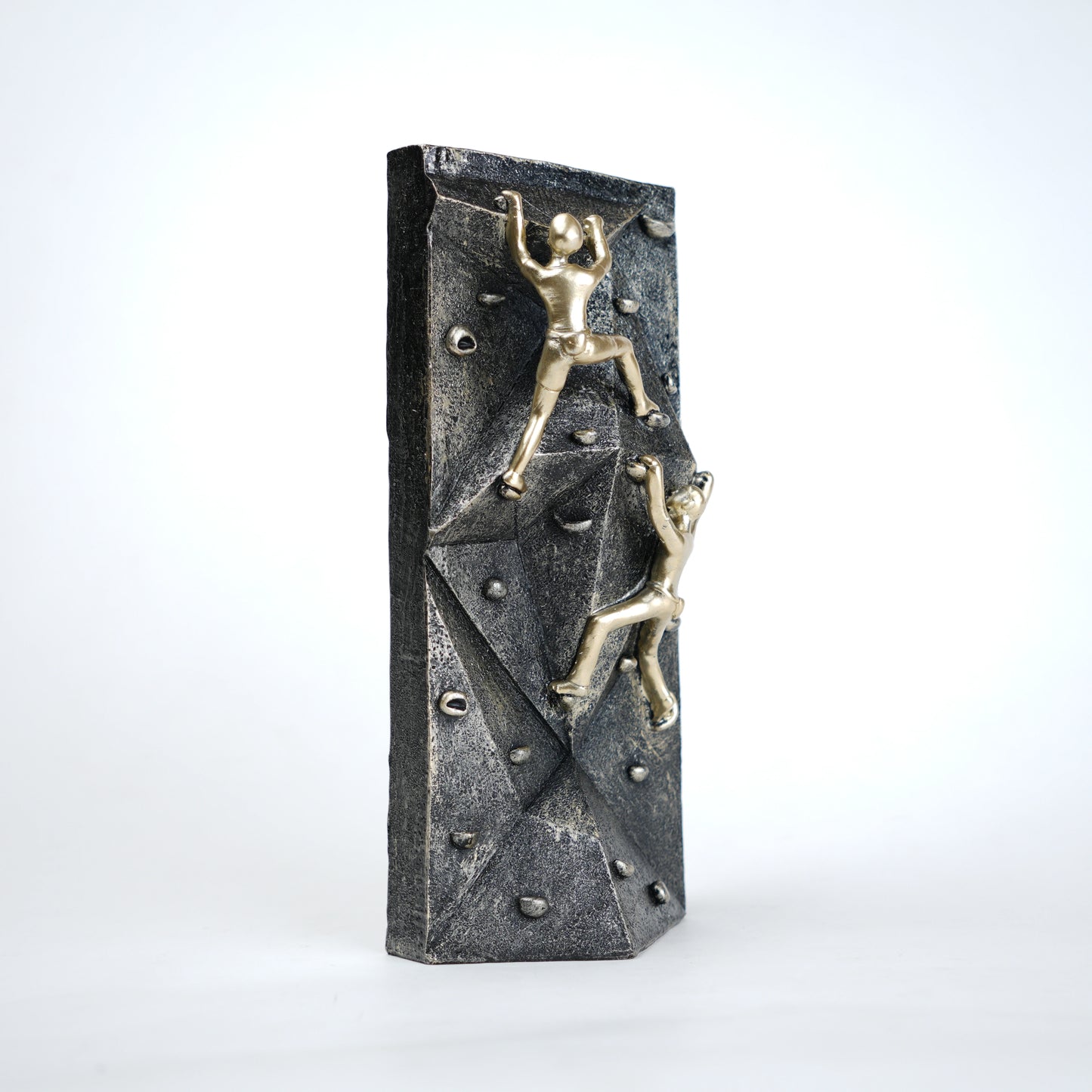 modern climbing figurine with gold climbers on textured rock base for home and office decor