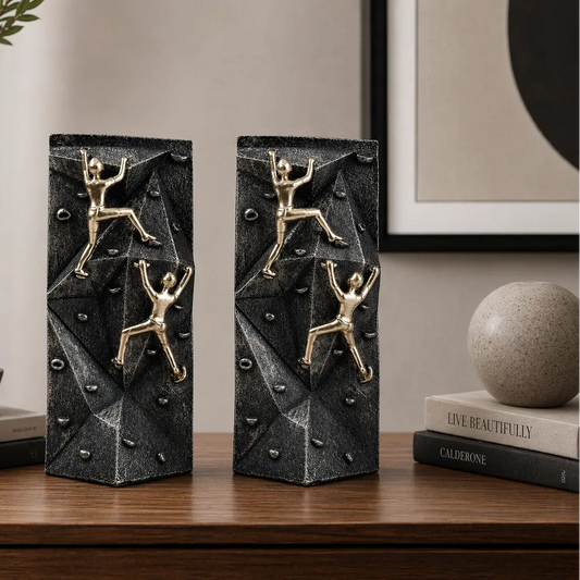 modern climbing figurine with gold climbers on textured rock base for home and office decor