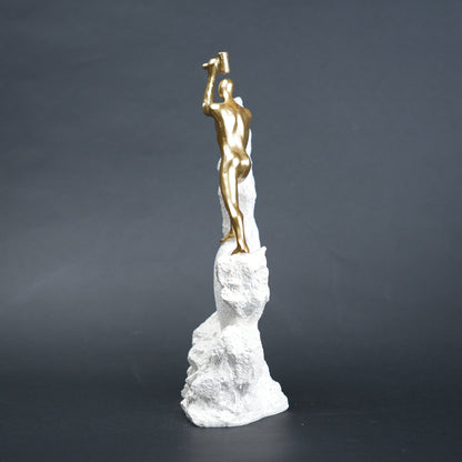 Teamwork climber figurine with gold figures pushing metallic sphere on textured rock base in black and white variants