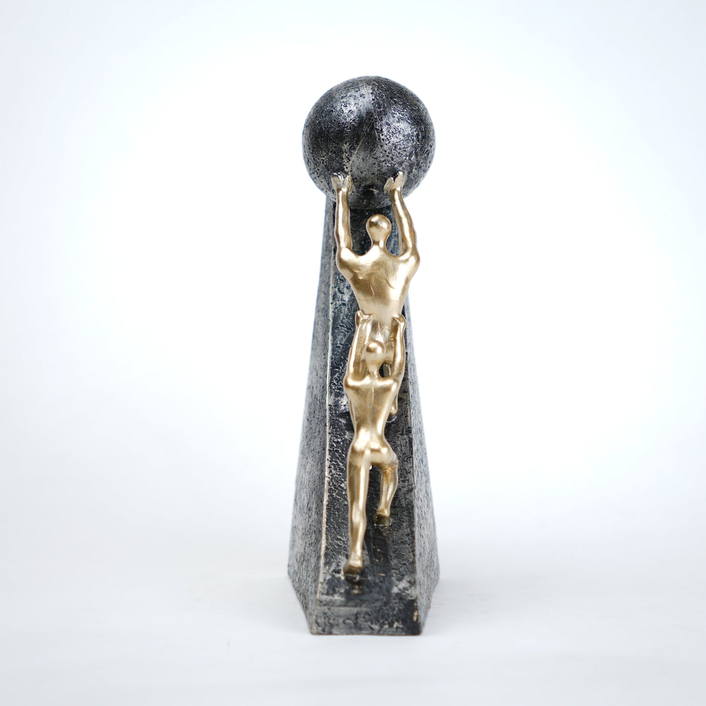 Mountain climber leadership sculpture with gold figurines guiding metallic sphere on textured stone base in black and white variants