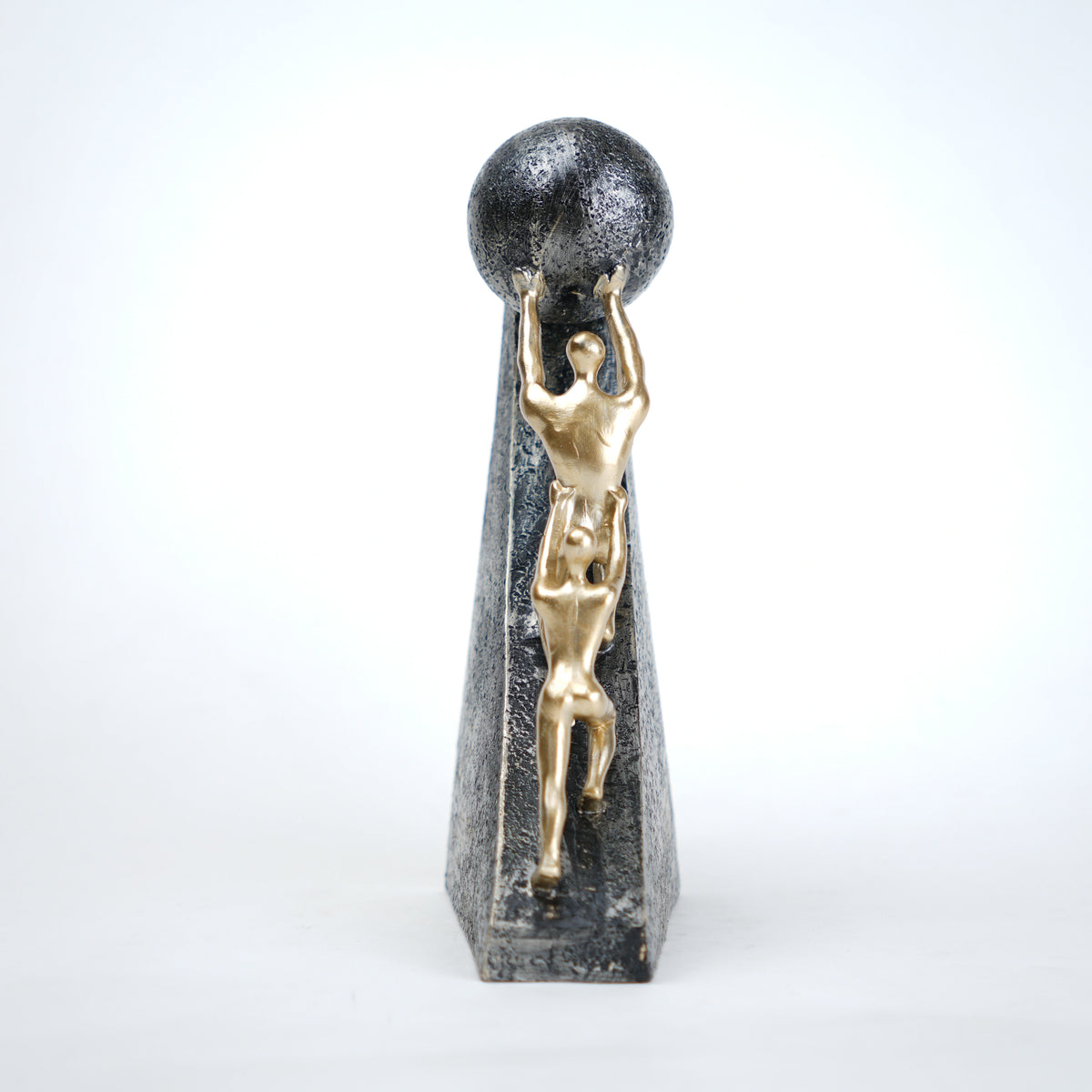 Mountain climber leadership sculpture with gold figurines guiding metallic sphere on textured stone base in black and white variants