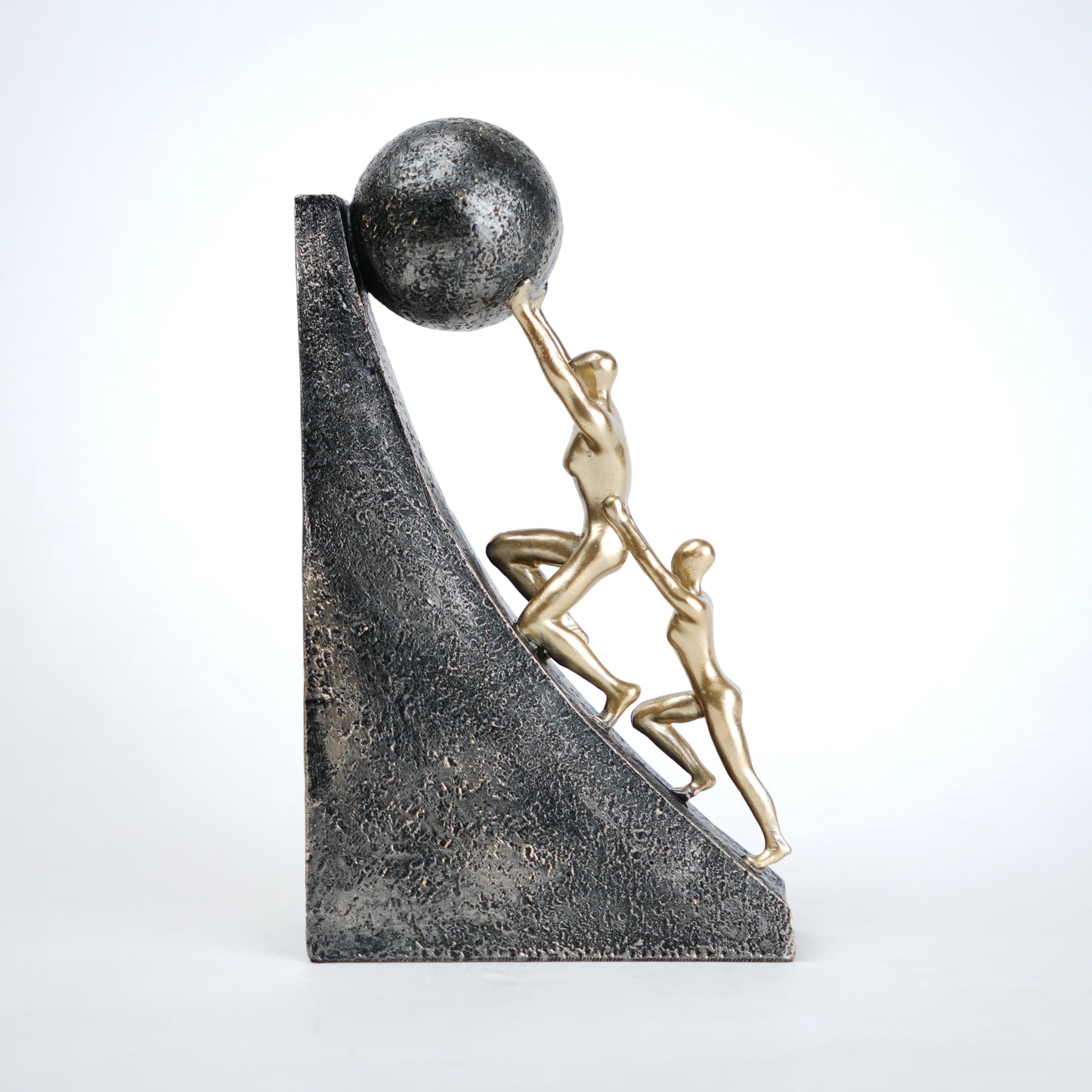 Mountain climber leadership sculpture with gold figurines guiding metallic sphere on textured stone base in black and white variants