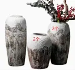 Textured ceramic decorative vases with hand-painted mountain landscape artwork in three sculptural shapes