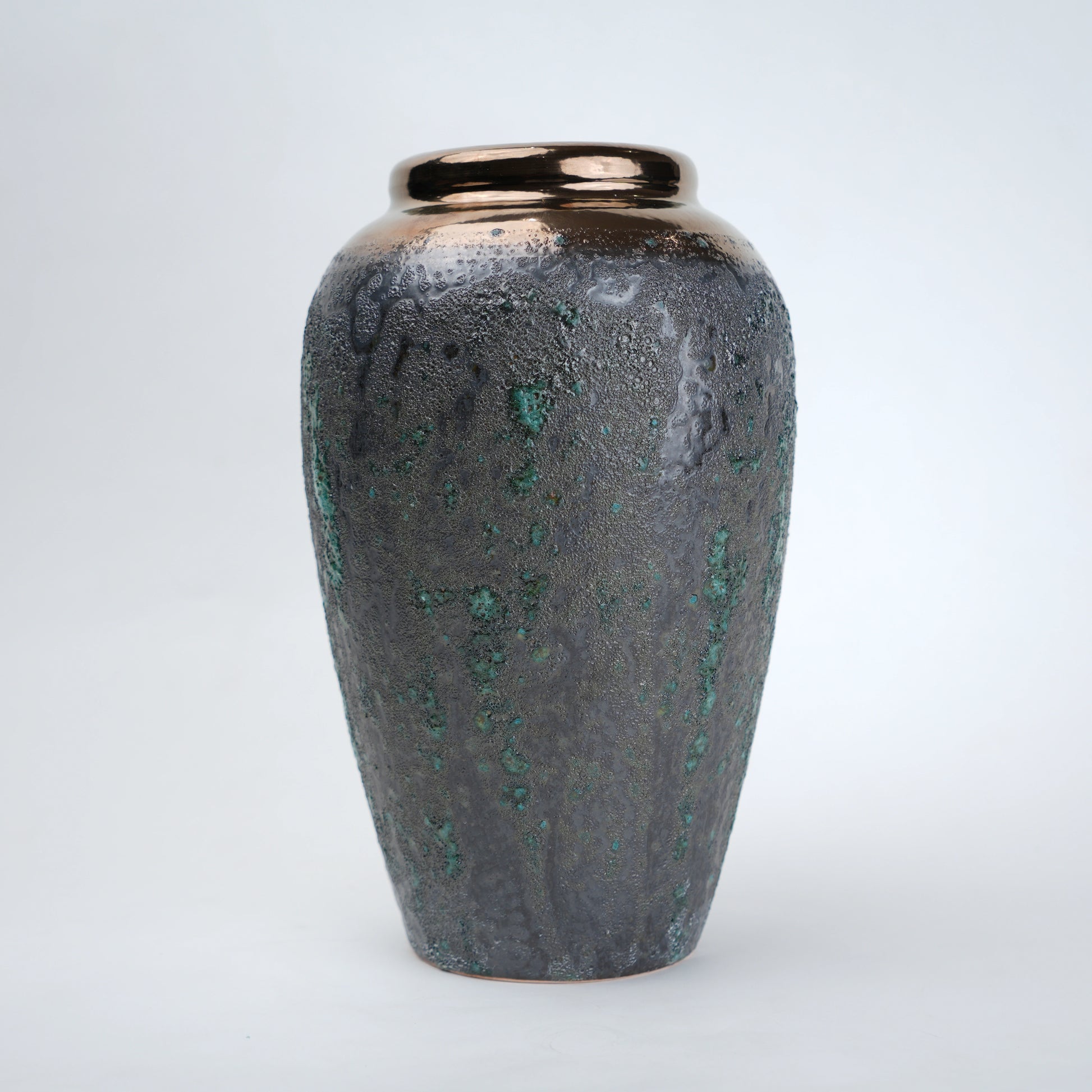 green charcoal ceramic vase with patina texture and bronze neck