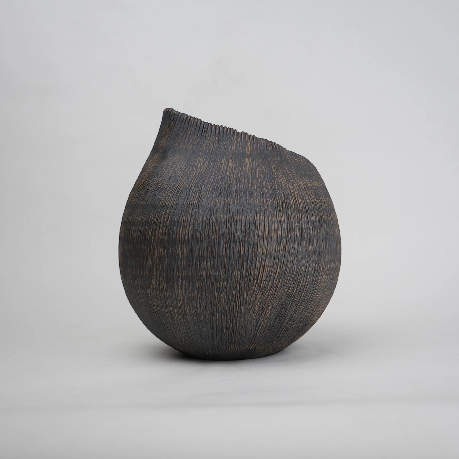 textured charcoal ceramic vase with angled rim