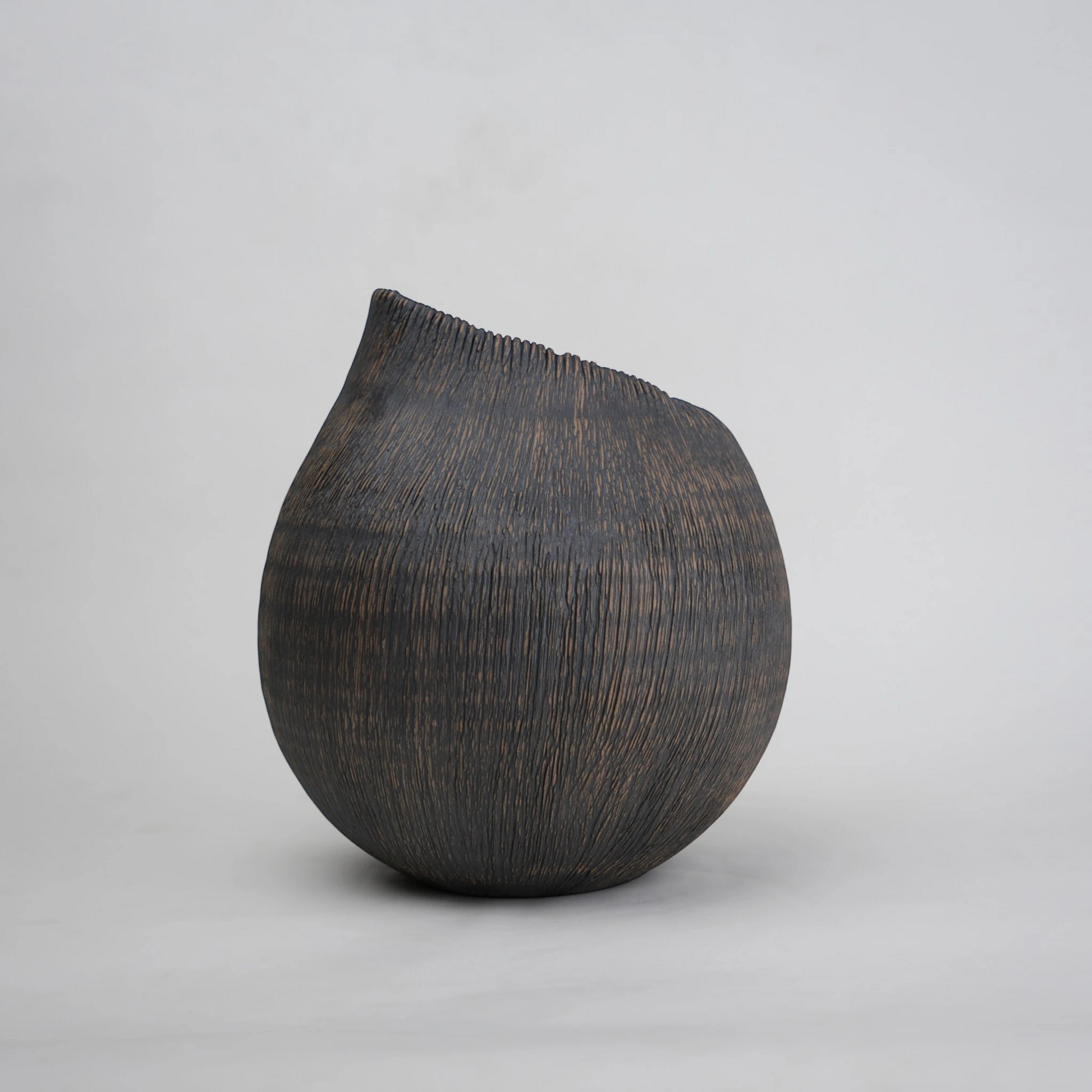 textured charcoal ceramic vase with angled rim