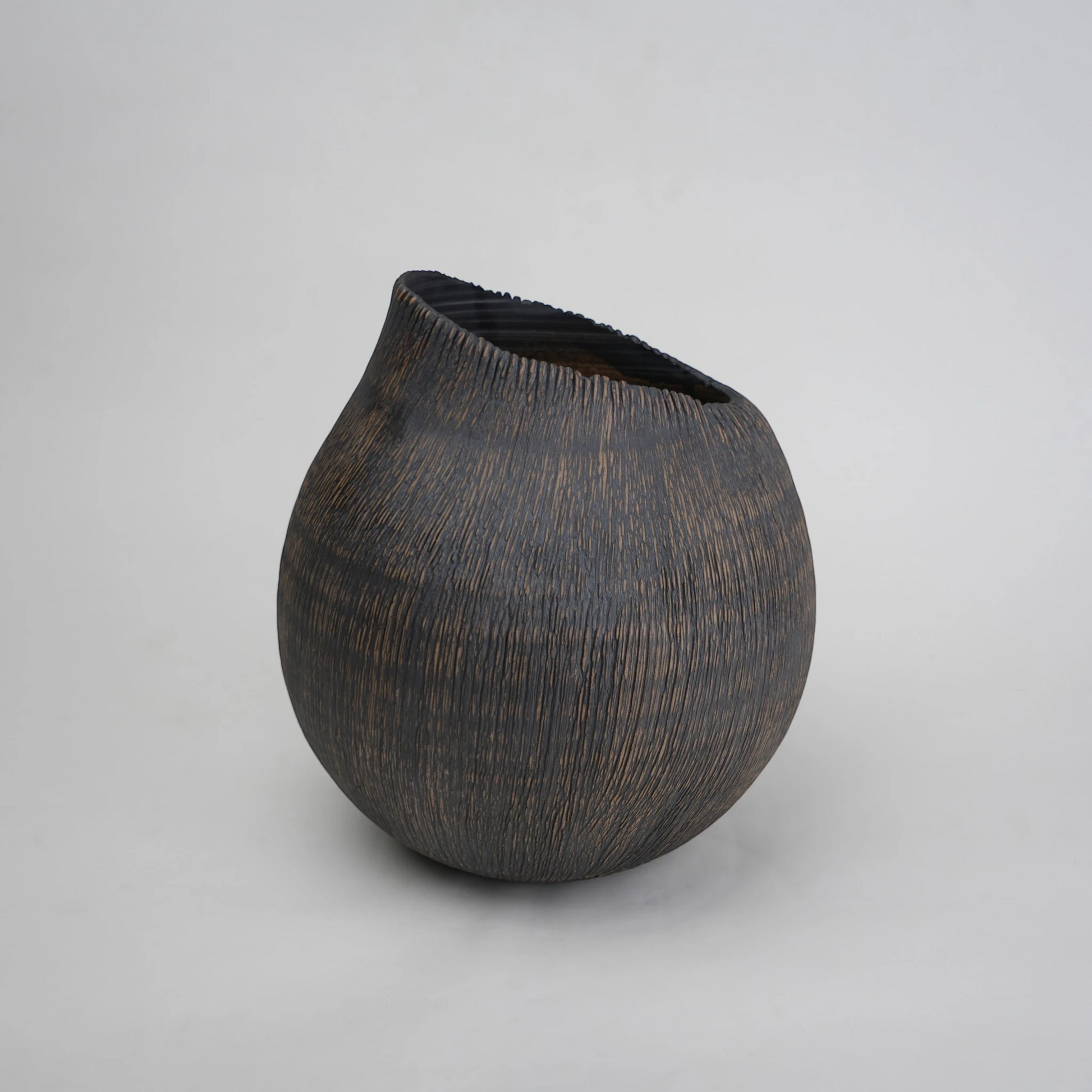 textured charcoal ceramic vase with angled rim