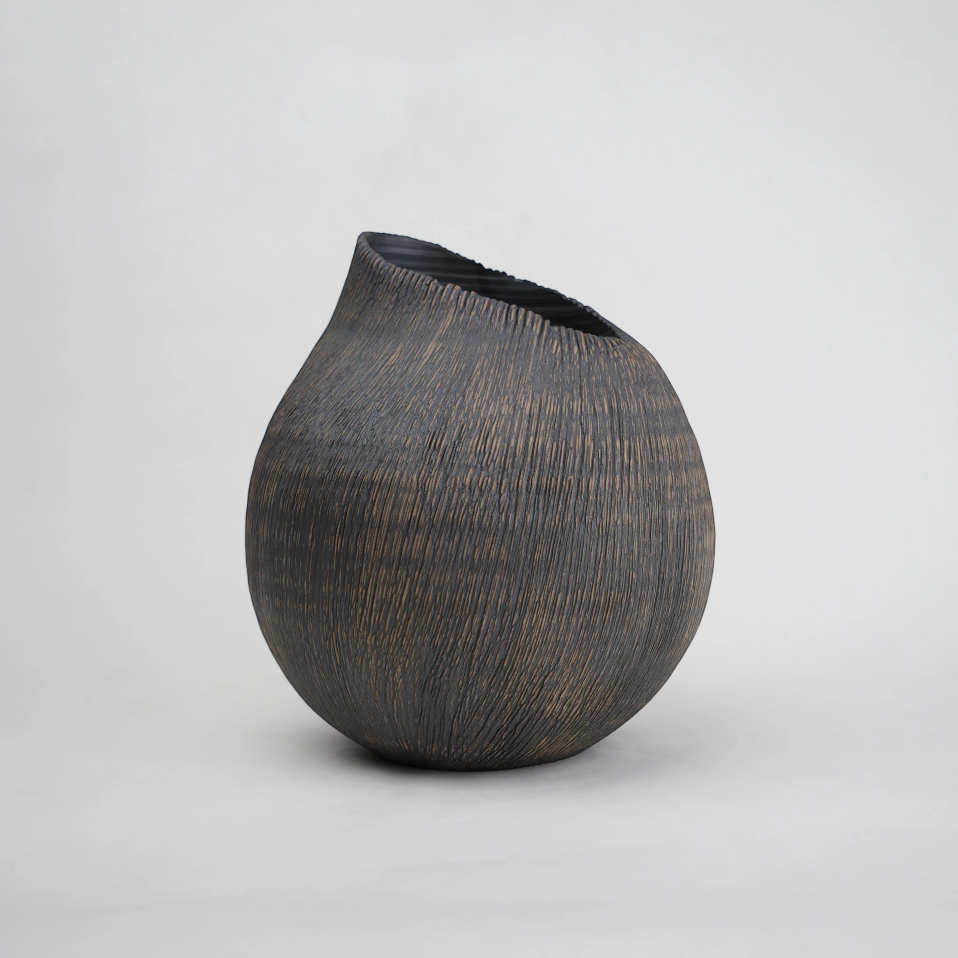 textured charcoal ceramic vase with angled rim