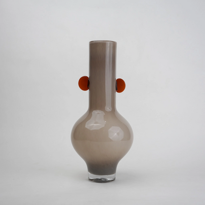 beige glass vase with amber side accents