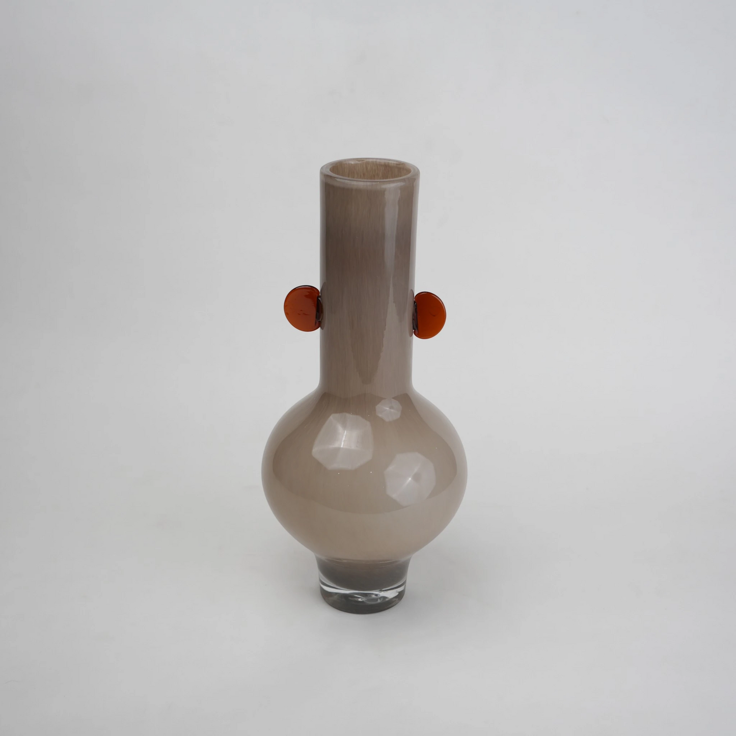 beige glass vase with amber side accents