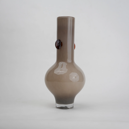 beige glass vase with amber side accents