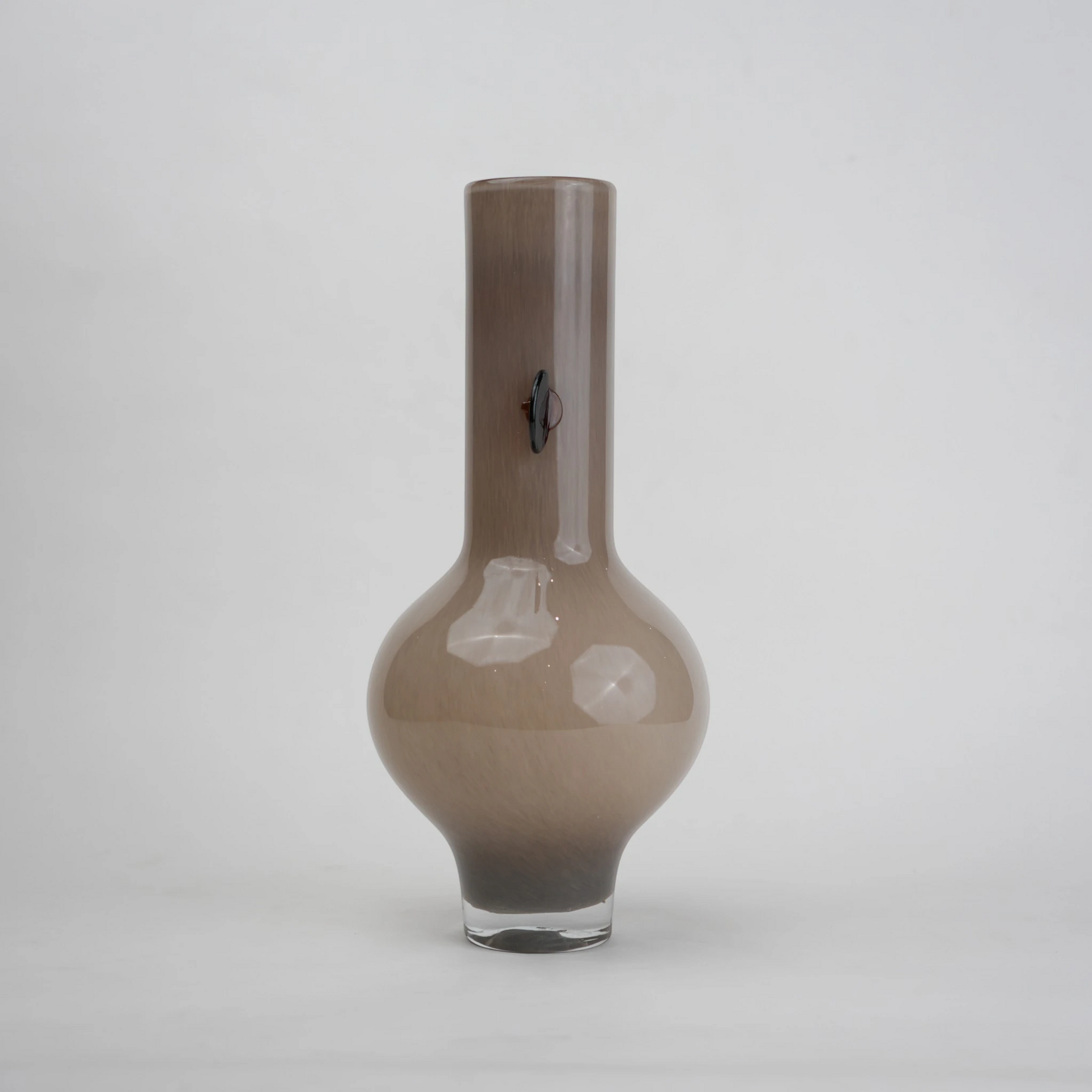 beige glass vase with amber side accents