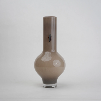beige glass vase with amber side accents