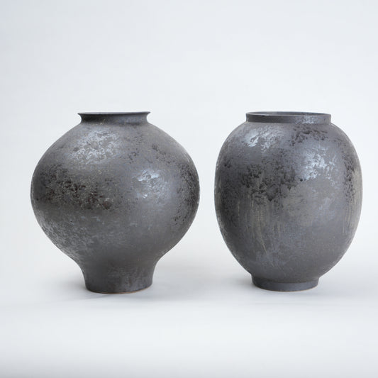 Two gray ceramic vases for styling flowers in living room, coffee tables or consoles