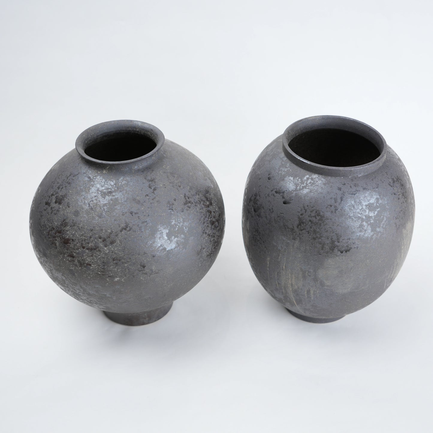 Two gray ceramic vases for styling flowers in living room, coffee tables or consoles