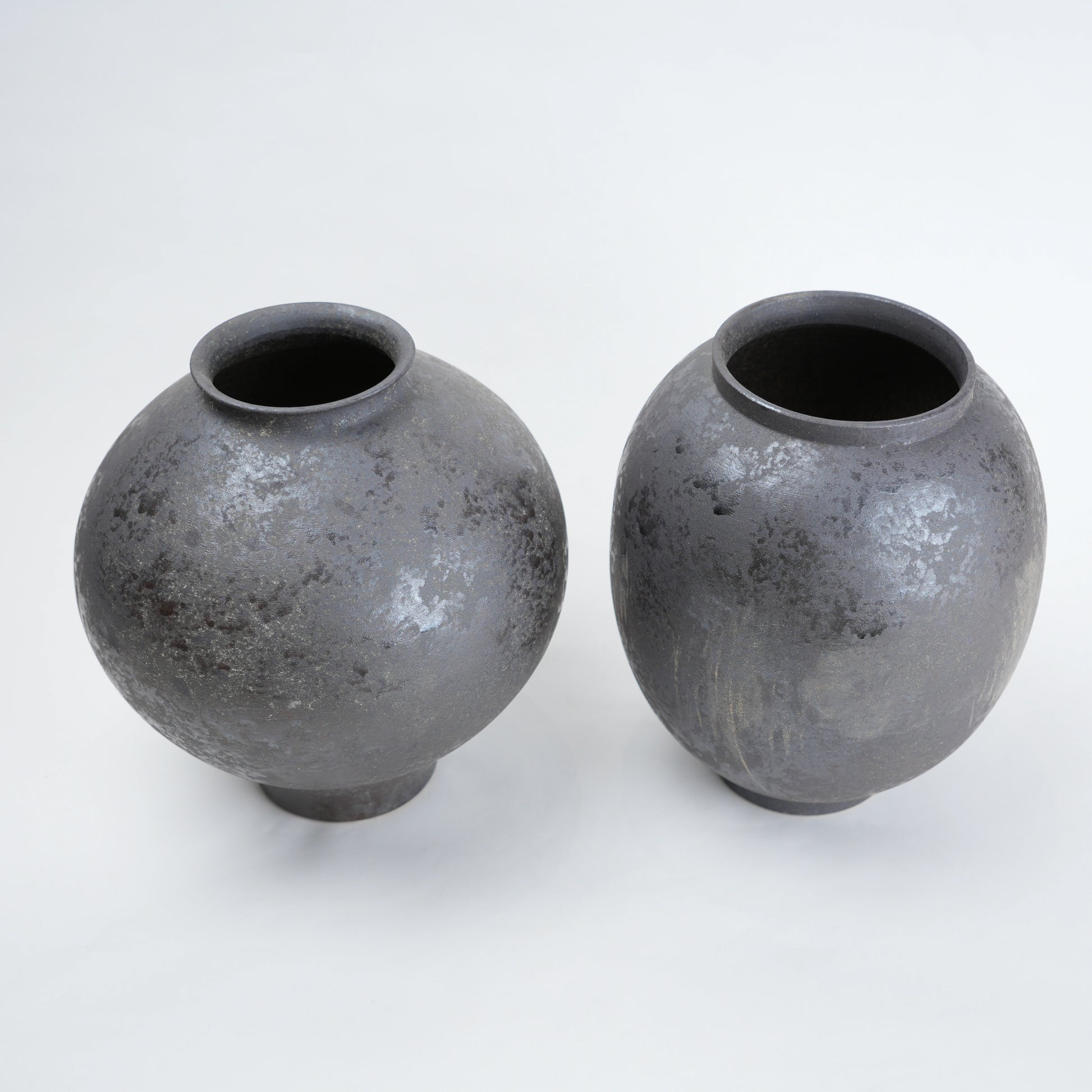 Two gray ceramic vases for styling flowers in living room, coffee tables or consoles