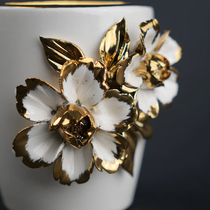White ceramic holder cup with gold floral detailing for bathroom and desk organization