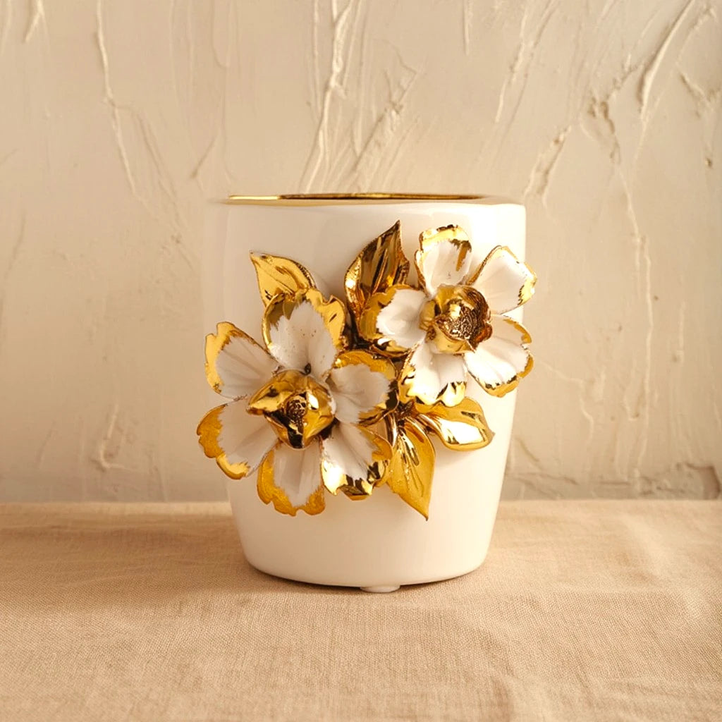 White ceramic holder cup with gold floral detailing for bathroom and desk organization