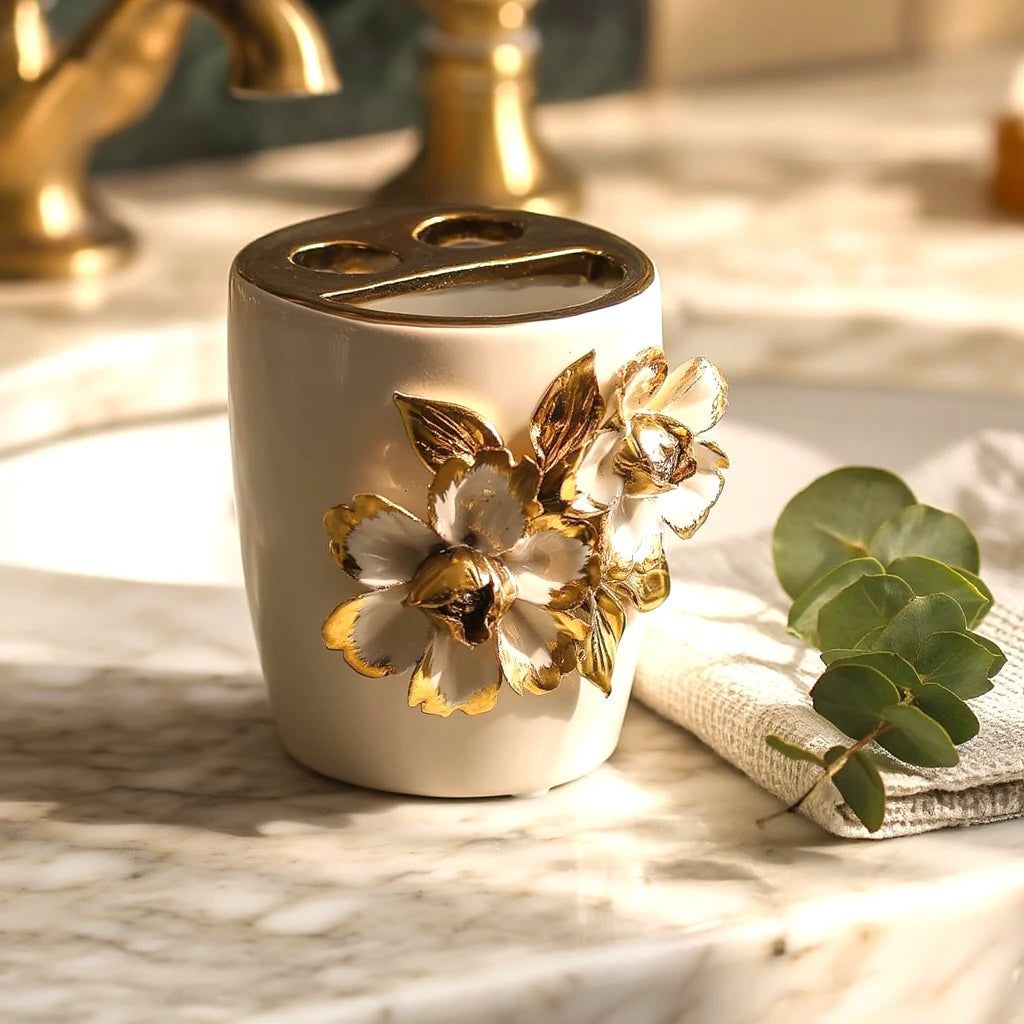 White ceramic holder cup with gold floral detailing for bathroom and desk organization