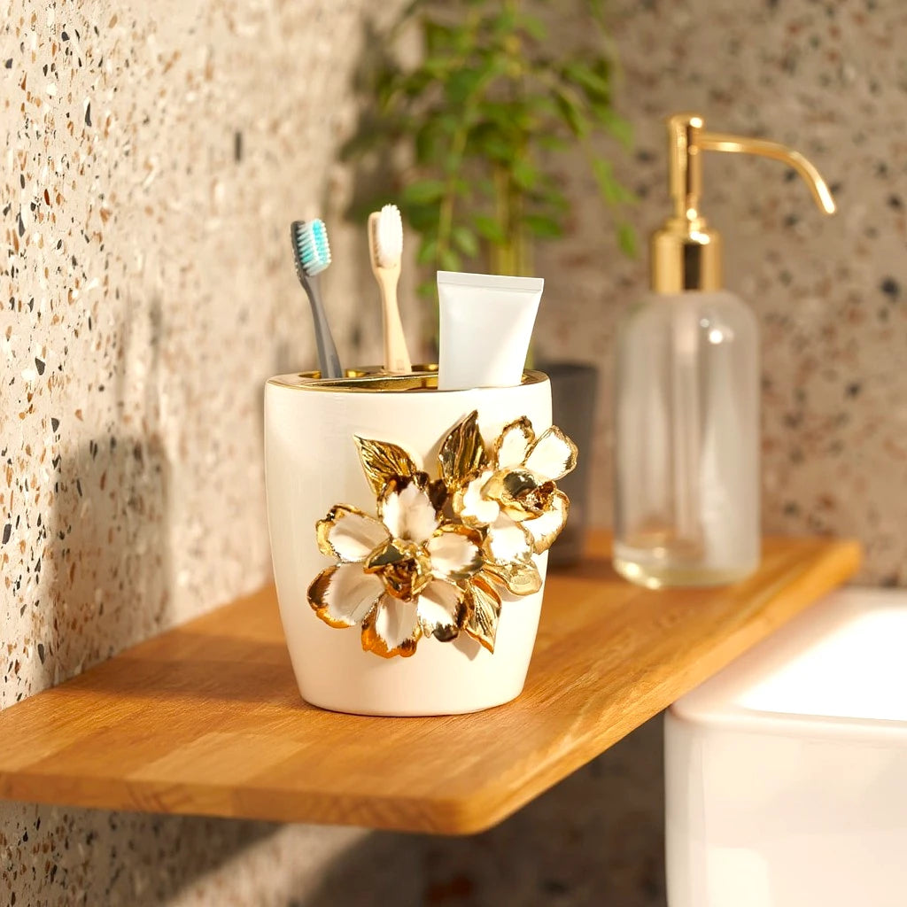 White ceramic holder cup with gold floral detailing for bathroom and desk organization