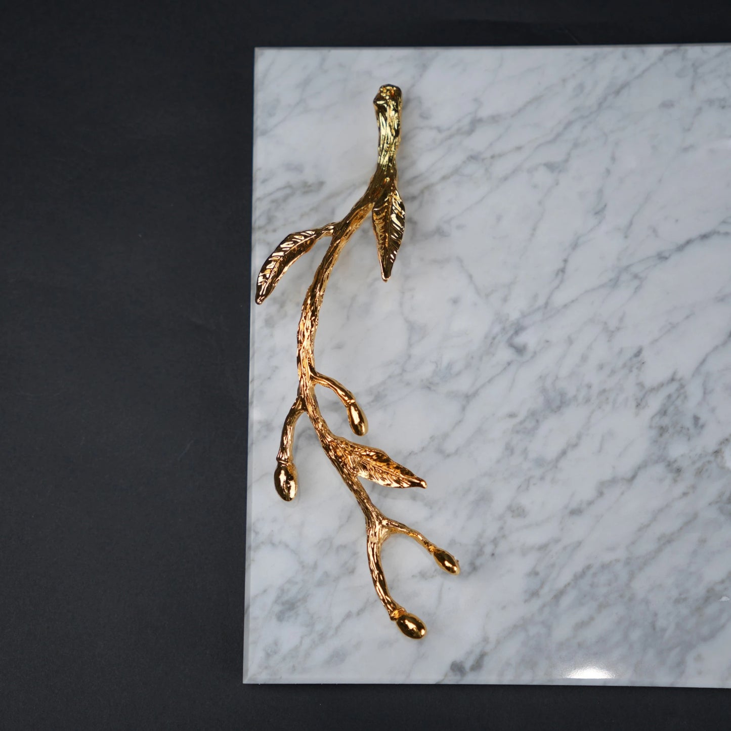 White marble serving platter with gold branch handles for luxury dining and table styling