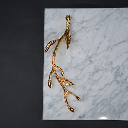 White marble serving platter with gold branch handles for luxury dining and table styling