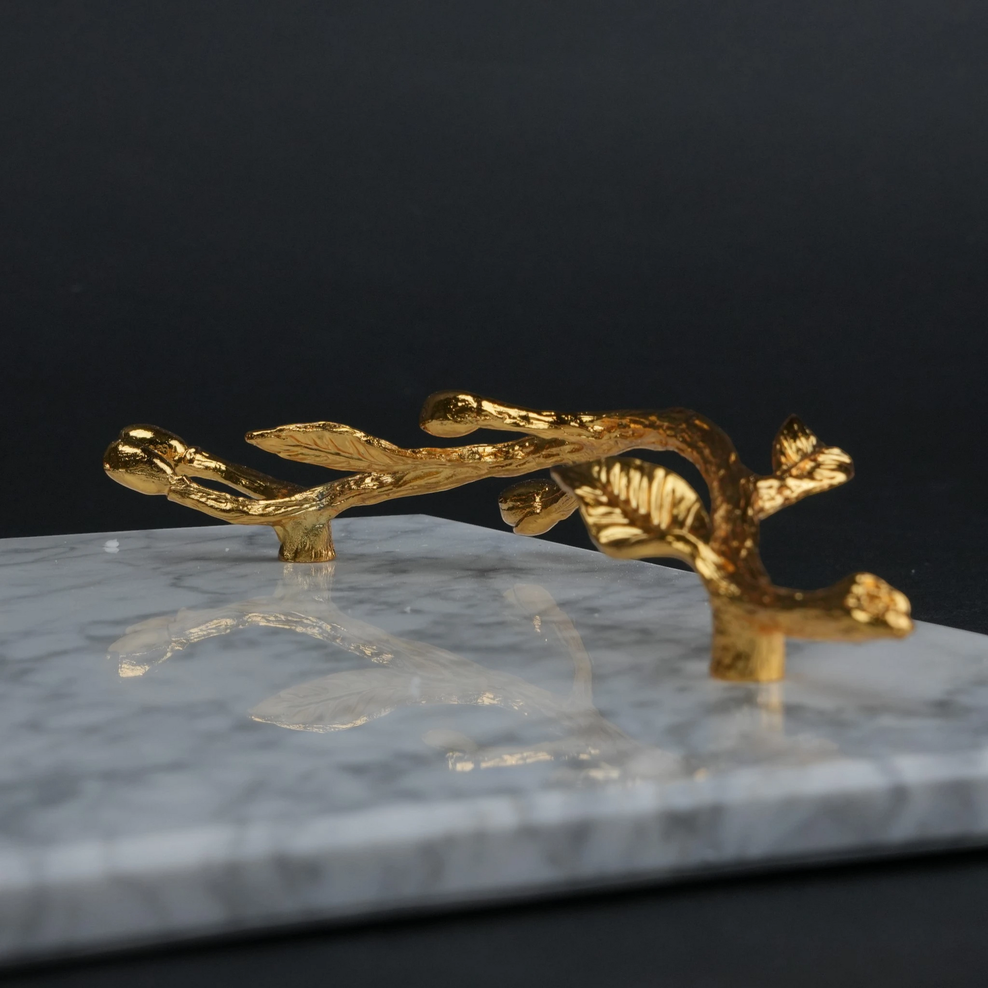 White marble serving platter with gold branch handles for luxury dining and table styling