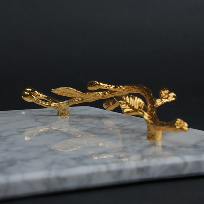White marble serving platter with gold branch handles for luxury dining and table styling