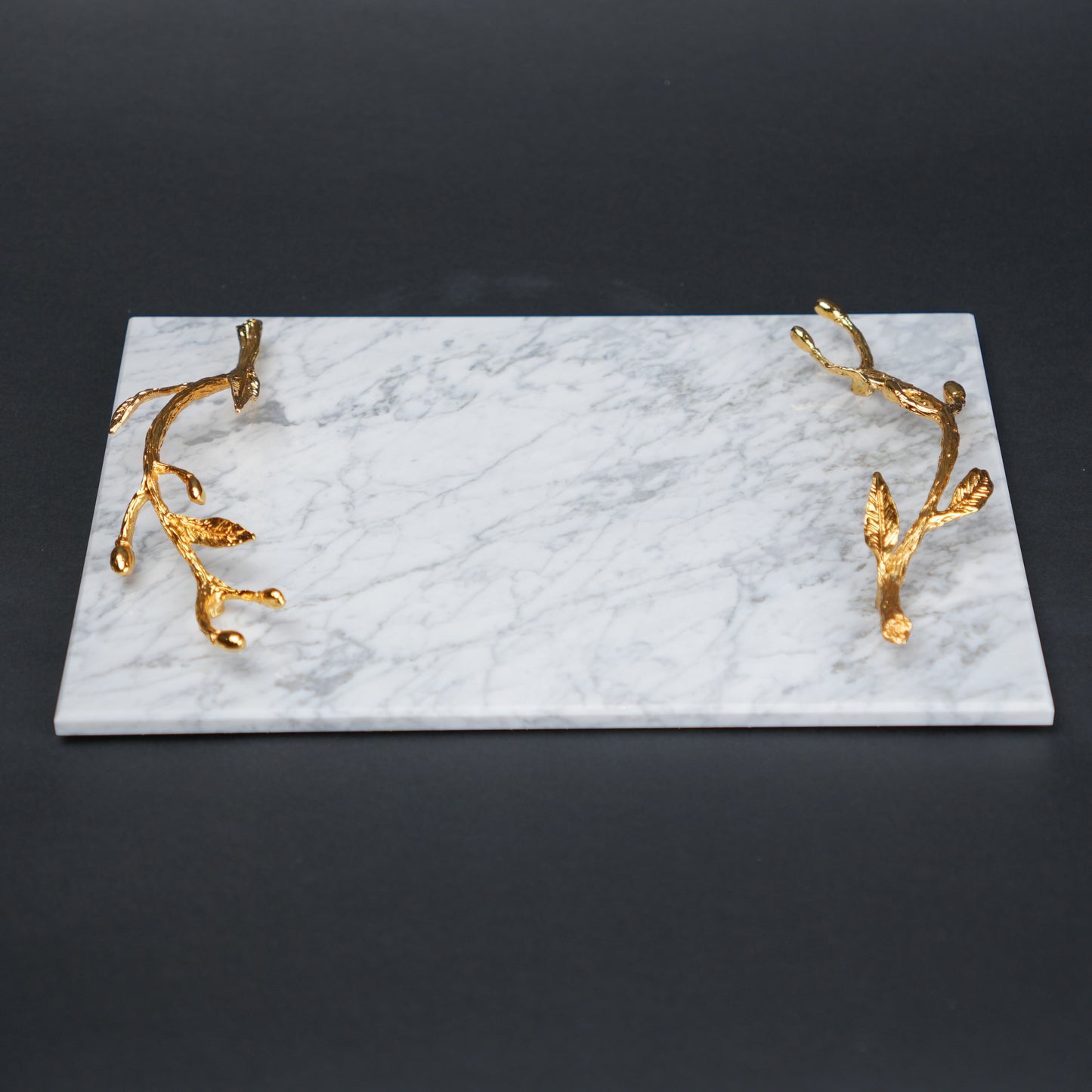 White marble serving platter with gold branch handles for luxury dining and table styling