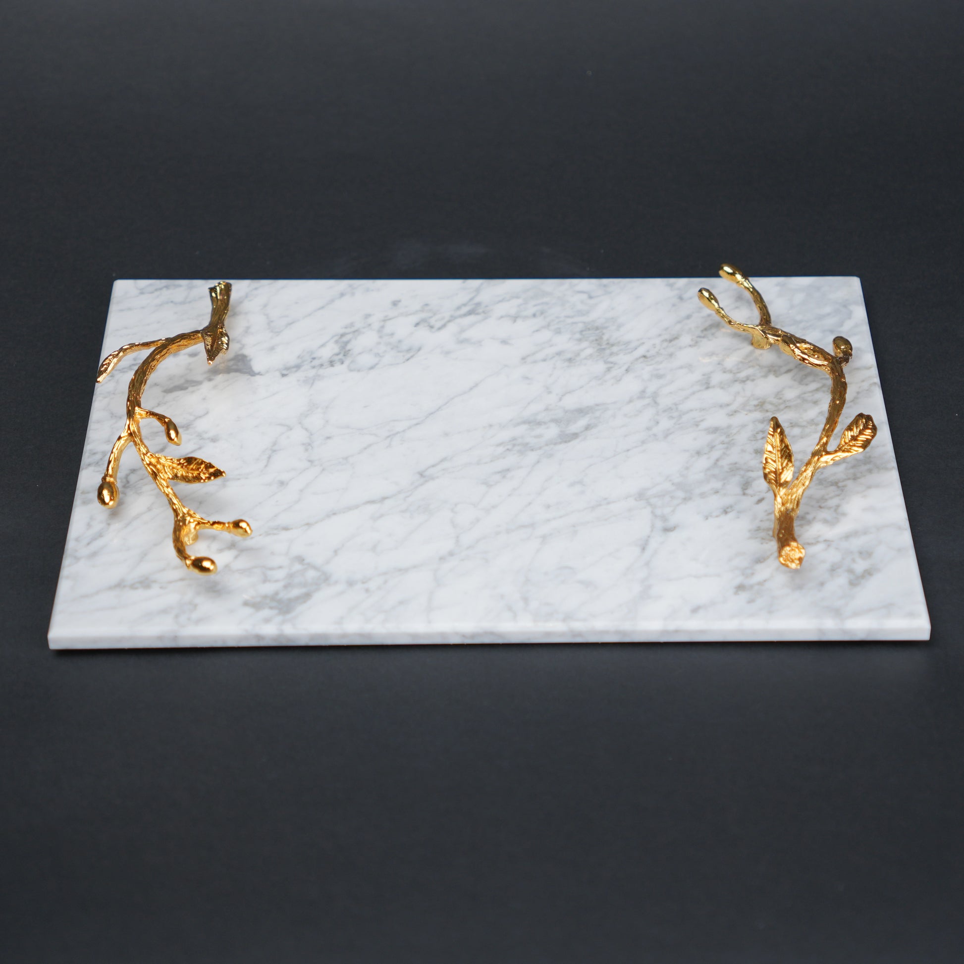 White marble serving platter with gold branch handles for luxury dining and table styling