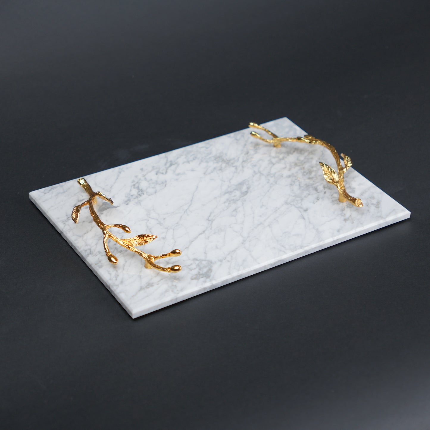 White marble serving platter with gold branch handles for luxury dining and table styling