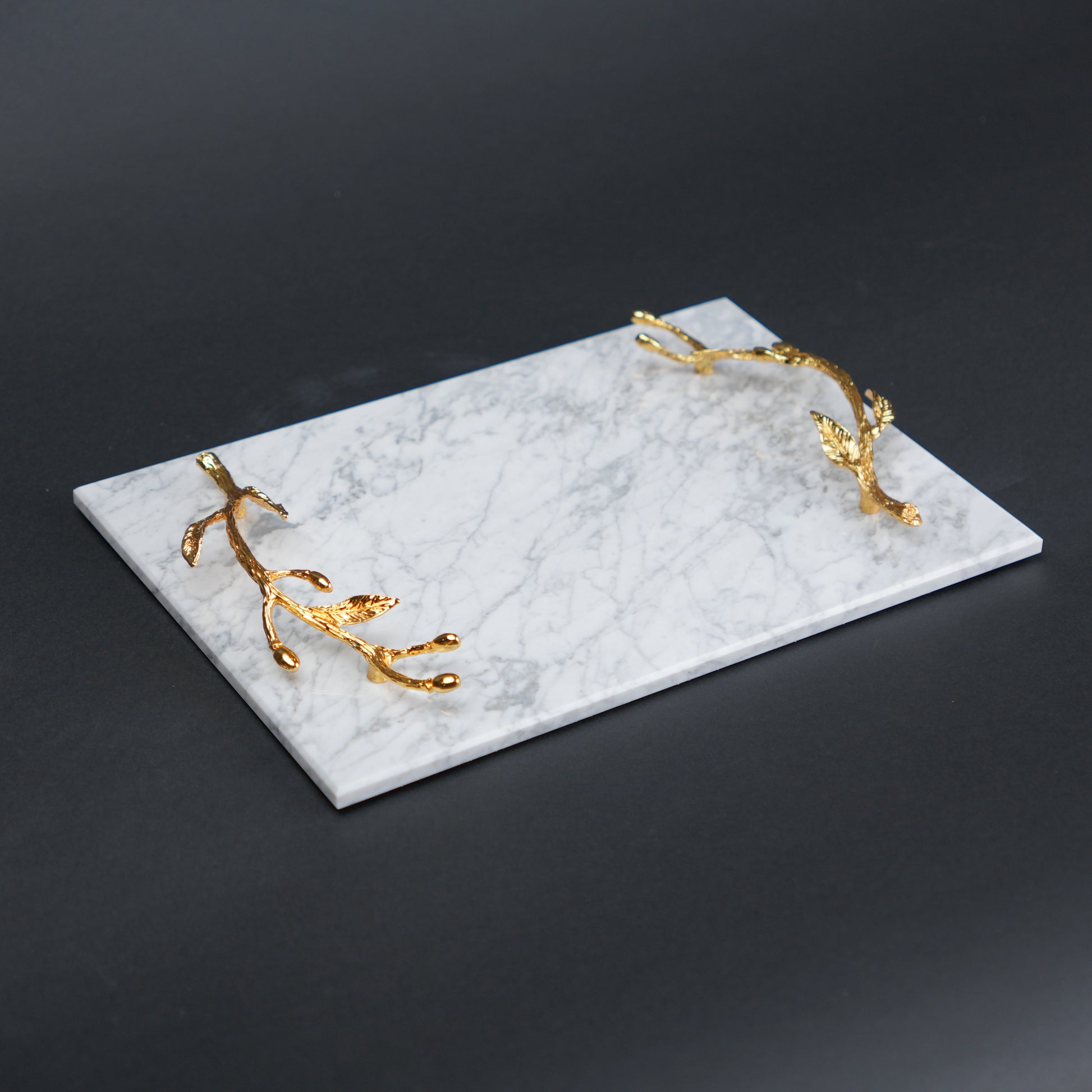 White marble serving platter with gold branch handles for luxury dining and table styling