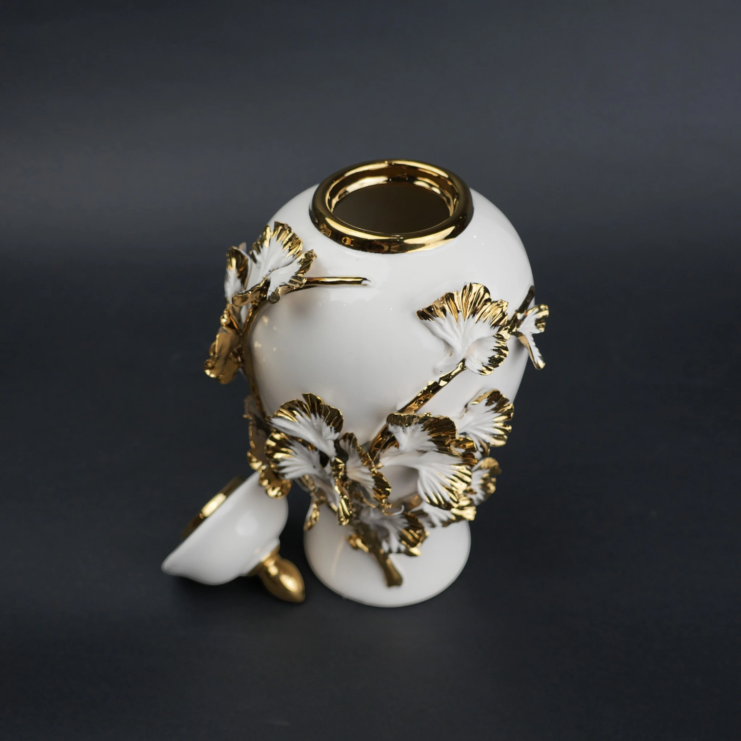 White ceramic jar with gold leaf detailing and lid for luxury home decor styling