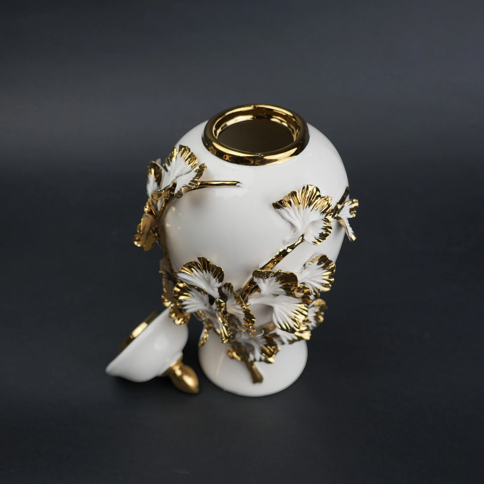 White ceramic jar with gold leaf detailing and lid for luxury home decor styling