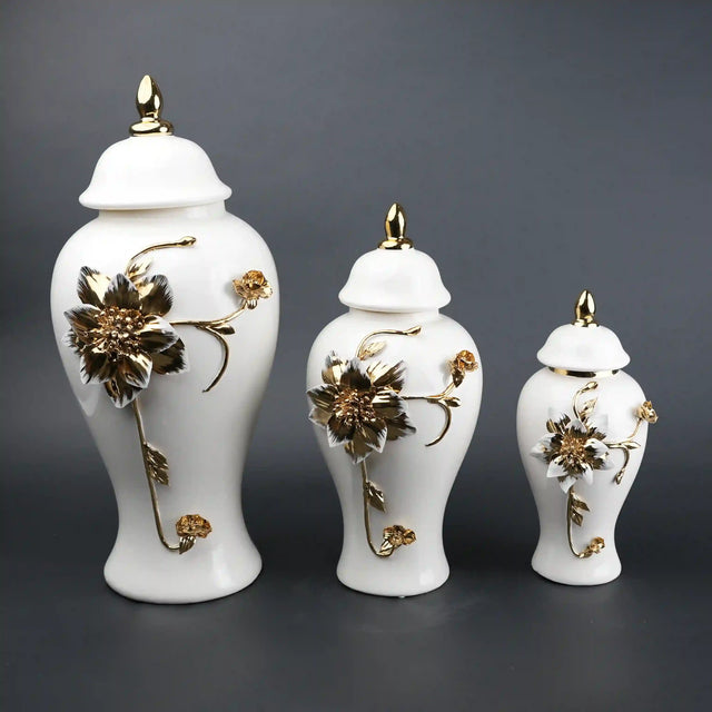 Luxury white ceramic decorative jars with gold floral detailing and lids, elegant home decor storage pieces in multiple sizes, perfect for living room styling, console decor, and premium interior accents.