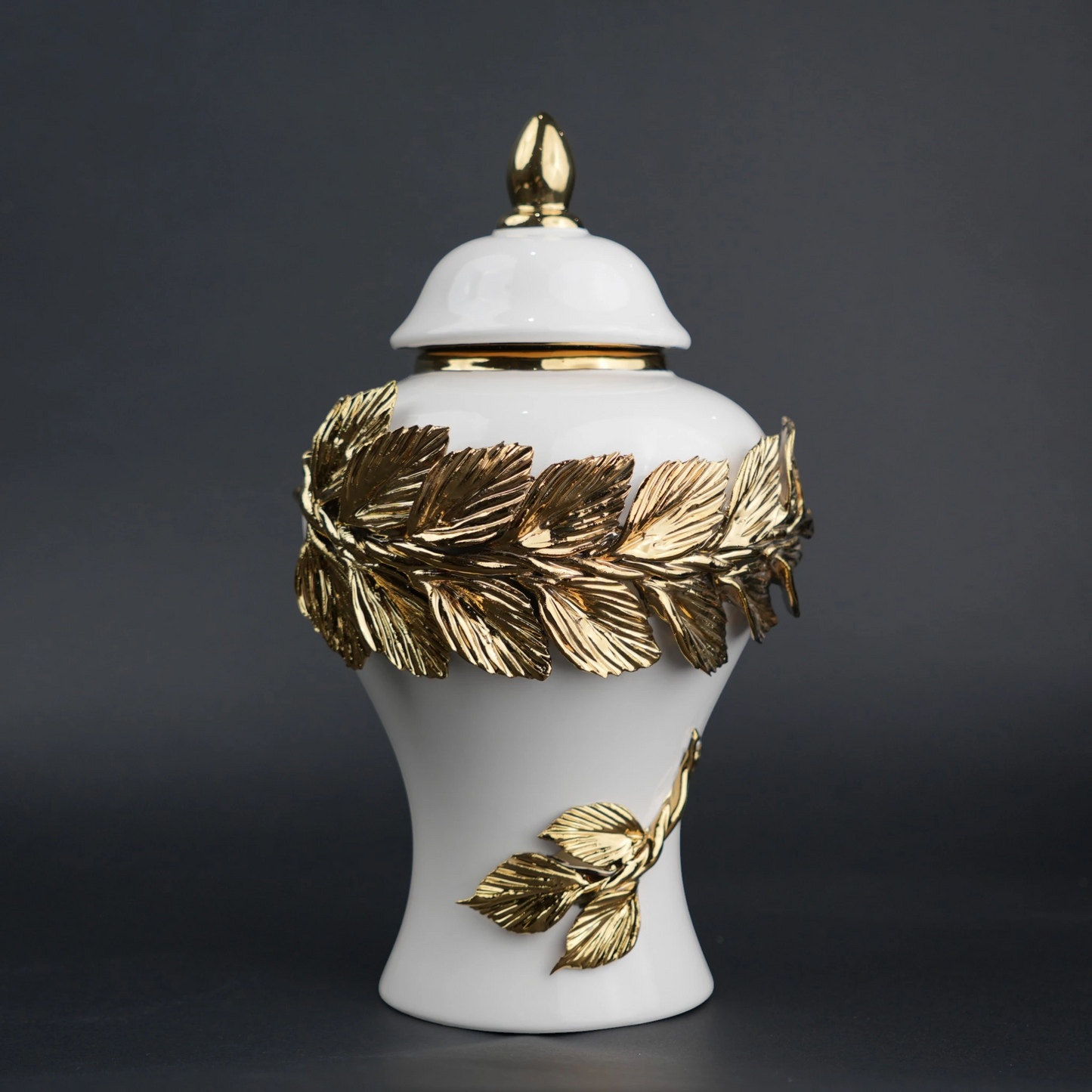 White ceramic decorative jar with gold laurel leaf band and lid