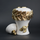 White ceramic decorative jar with gold laurel leaf band and lid