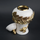 White ceramic decorative jar with gold laurel leaf band and lid