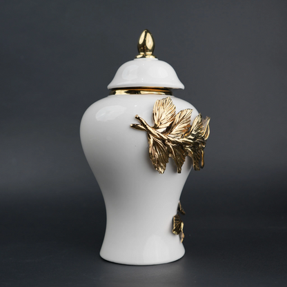 White ceramic decorative jar with gold laurel leaf band and lid