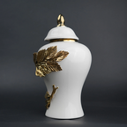 White ceramic decorative jar with gold laurel leaf band and lid