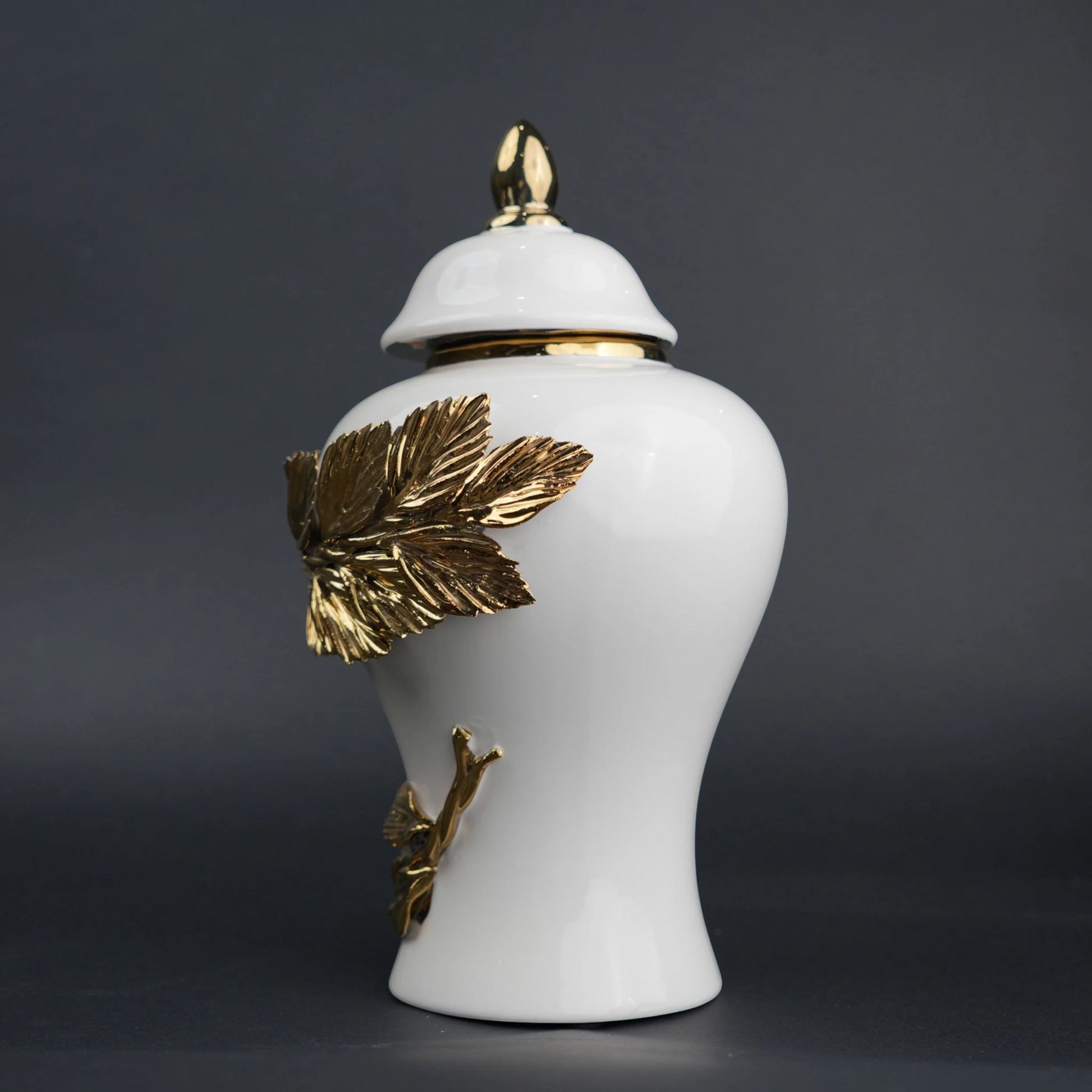 White ceramic decorative jar with gold laurel leaf band and lid