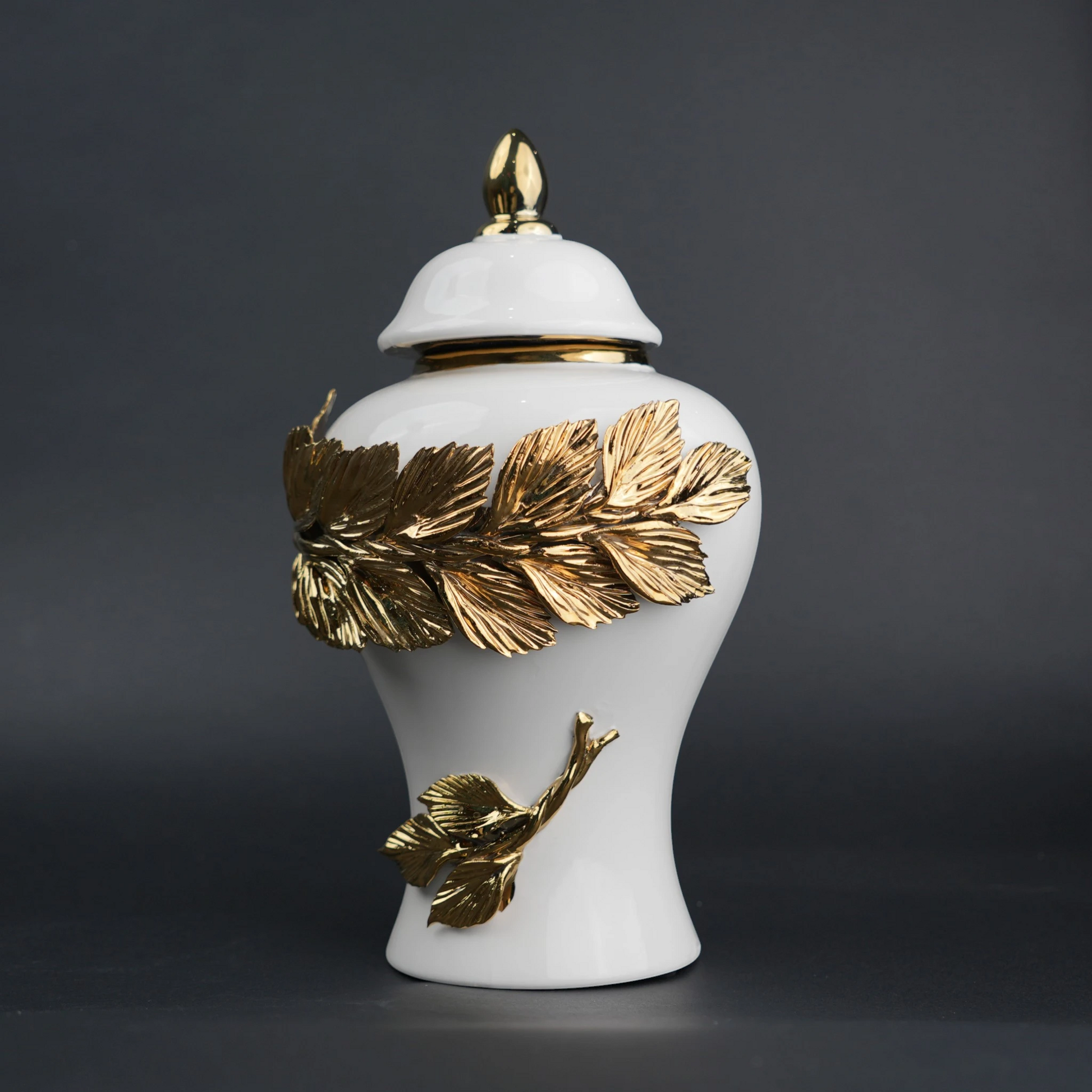 White ceramic decorative jar with gold laurel leaf band and lid