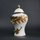 White ceramic decorative jar with gold laurel leaf band and lid