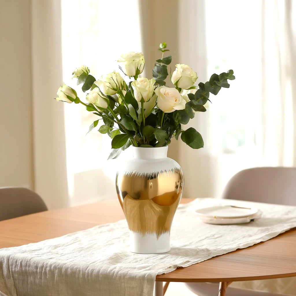 Gilded brush jar w/ roses, sunlit dining