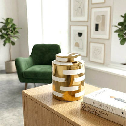 Golden stroke jar by emerald velvet chair