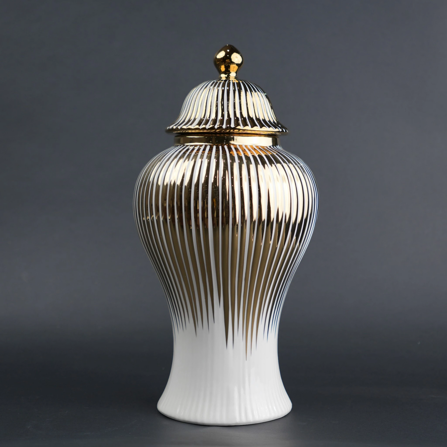 White ceramic jar with gold vertical stripes and lid for luxury home decor styling